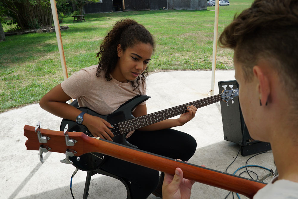 guitar lesson at arts camp